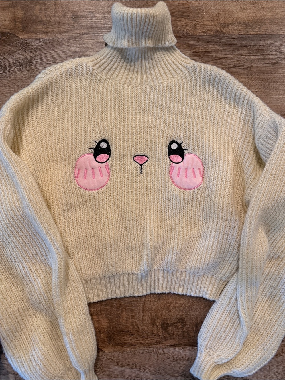 Cream Turtleneck Cropped Sweater with Pink Embroidered Face